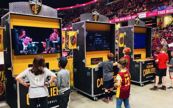 Fans playing at Cleveland Cavaliers video-game kiosks built by Martin Sports